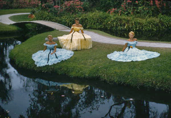 View showing Southern Belles in vintage dresses at the Cypress Gardens theme park in Winter Haven, Florida.