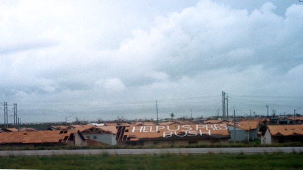 Message seeking assistance from President Bush written on rooftop following Hurricane Andrew - Homestead, Florida