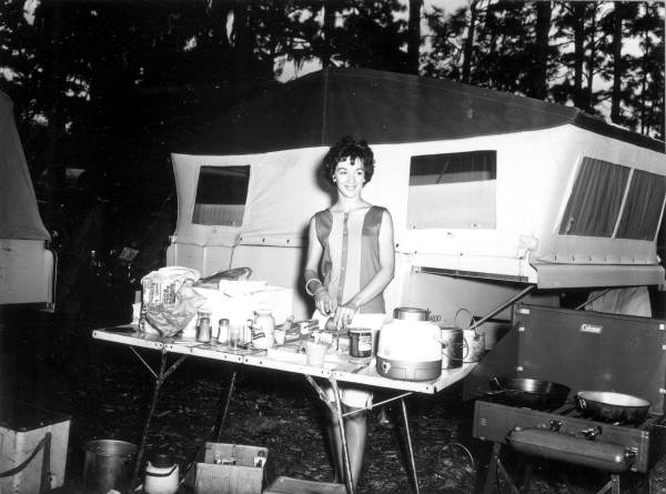 Young woman prepares a meal at a camping convention - Gainesville, Florida