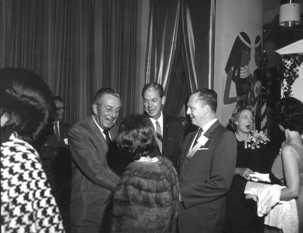 Walt Disney greeting people during a press conference - Orlando, Florida