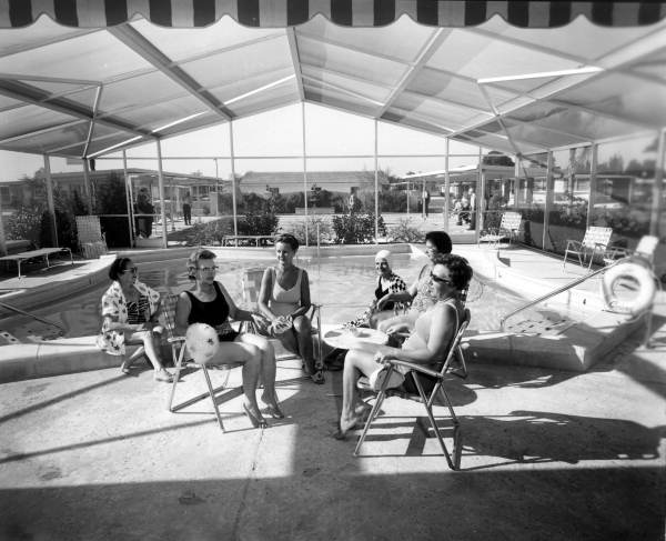 Ladies sit near the community swimming pool - Fort Lauderdale, Florida 
