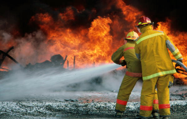 Members of the Key West Fire Dept. practice with NASKW firefighters at the "Hot drill" pit.