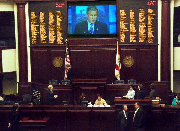 President George W. Bush is shown on the House floor presentation screen, top, as he outlines in a video his vision for future U.S. space missions Thursday, April 14, 2005.