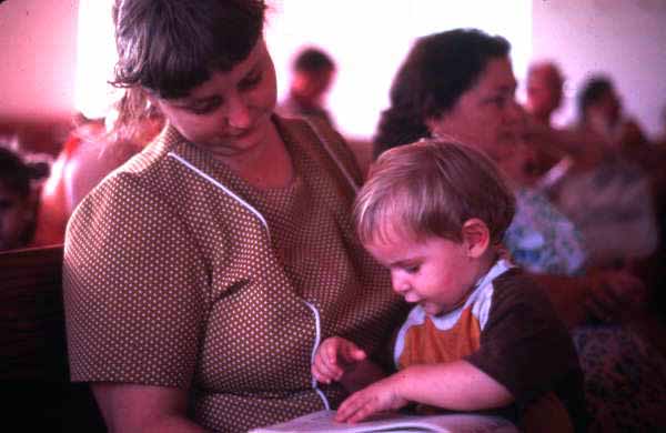 Mother and son with a Sacred Harp book at the Bethlehem Primitive Baptist Church - Old Chicora, Florida