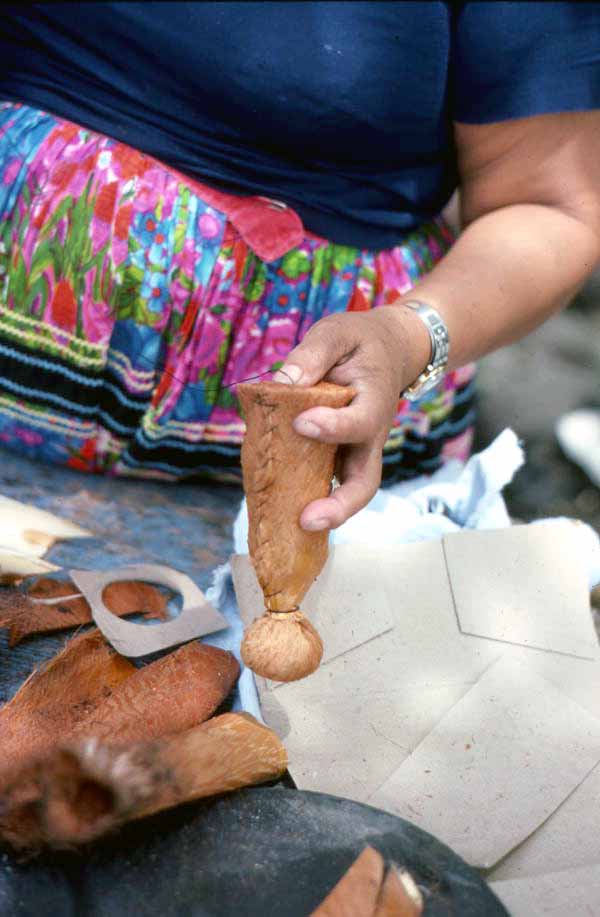 Mary Billie sewing on the bottom of the Seminole doll she is making - Big Cypress Reservation, Florida