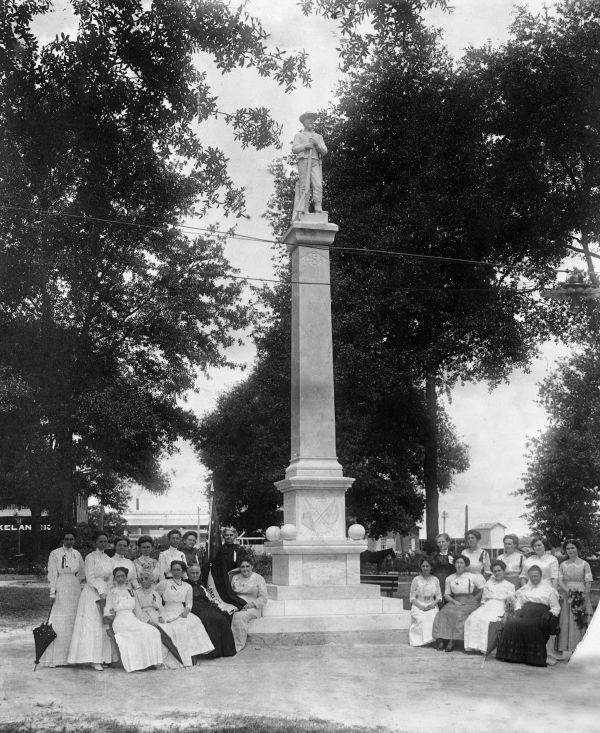 Members of the United Daughters of the Confederacy, seated around a Confederate monument in Munn Park - Lakeland, Florida