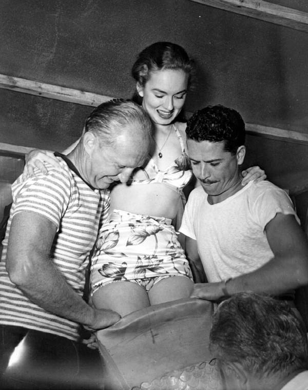 Staff helping Ann Blyth fit into her tail - Weeki Wachee Spring, Florida