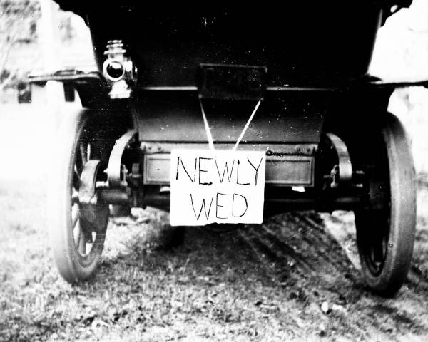 Newly wed sign on back of car