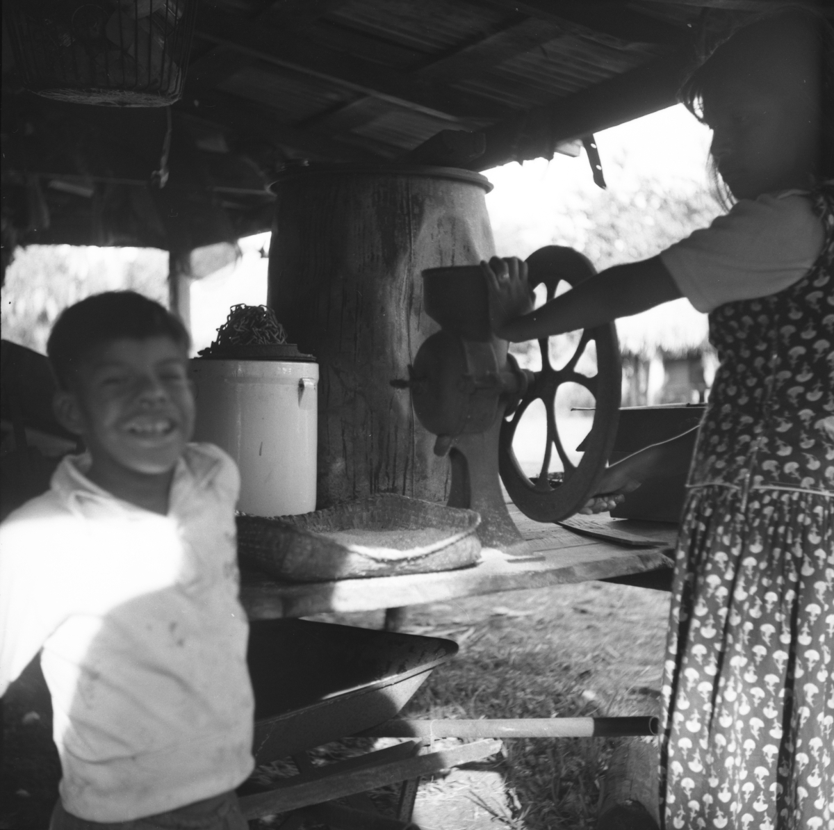 Seminole girl grinding corn for sofkee