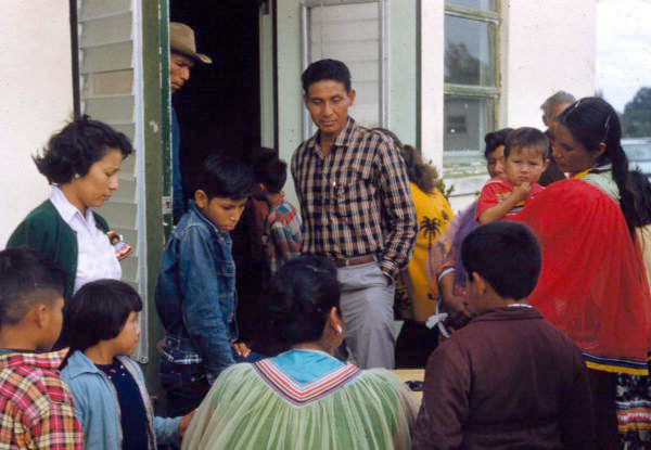 Seminole Indians gathered around a table