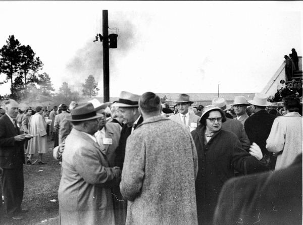 Charley E. Johns shaking hands in a crowd at his campaign to be Governor barbecue