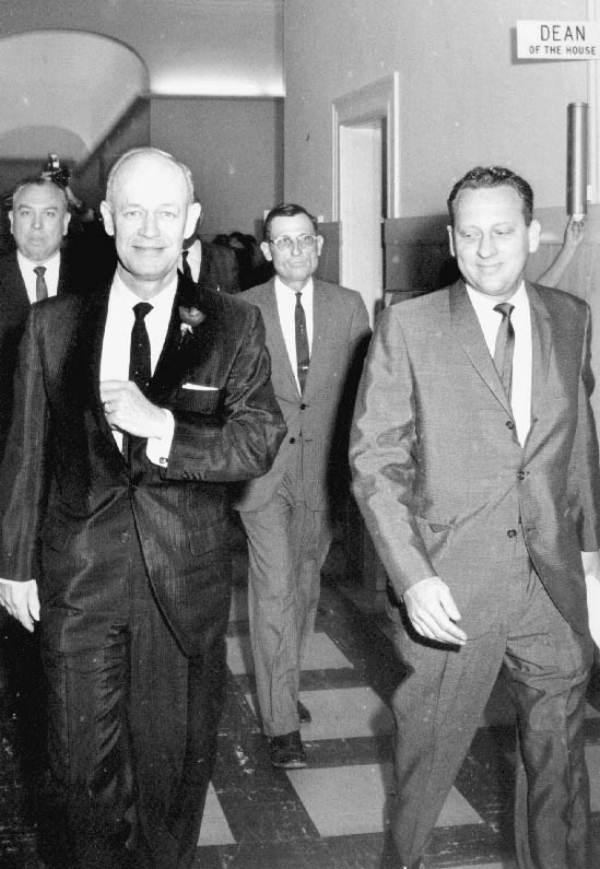 Florida Governor Farris Bryant walking down hallway with men