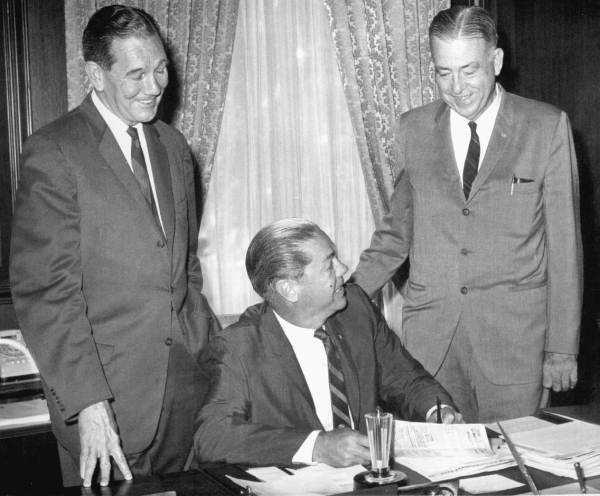 Florida Governor Haydon Burns at his desk with Senator Wilson Carraway