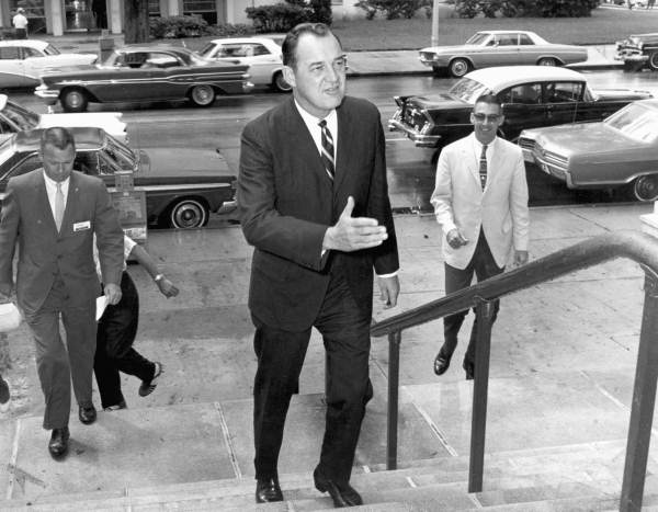 Florida Governor Claude Kirk walking up steps