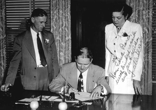 Governor Fuller Warren signing a bill into law