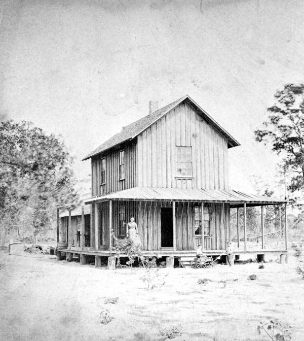 Mary S. Powers Davis on porch of her home