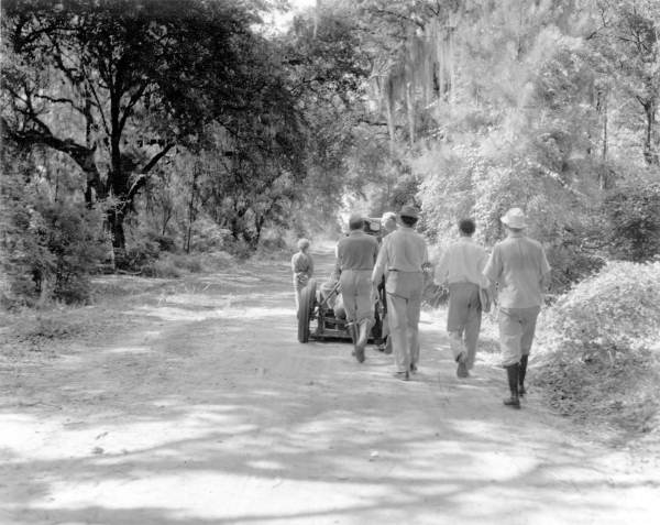 Film crew transporting camera during filming of Tarzan movie