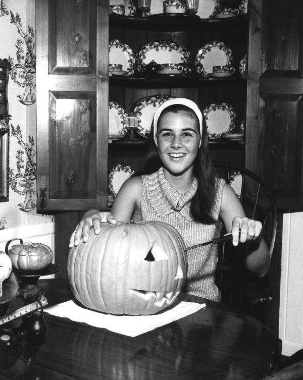 Pine Crest School student carving a Halloween pumpkin - Fort Lauderdale, Florida