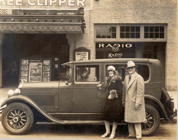 Miss Eva Boswell and Ed A. Crane standing with a Marmon automobile in front of the Capitol Theatre - Jacksonville, Florida