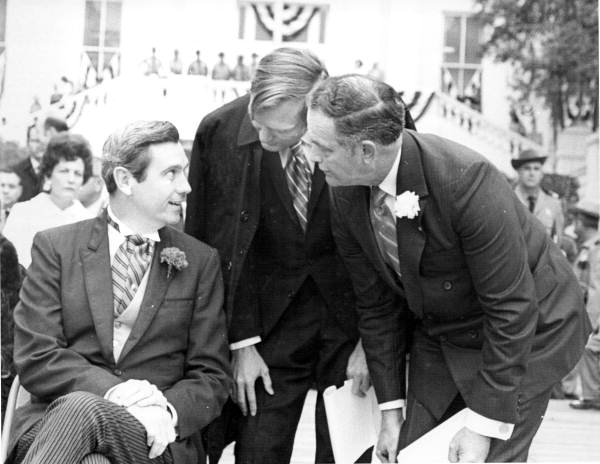 Florida's 37th Governor Reubin Askew talking to two unidentified guests at inaugural ceremony - Tallahassee, Florida