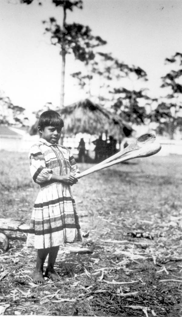 Seminole Indian boy with sofkee spoons
