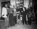 Group posing together outside a theater in Palm Beach.