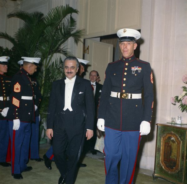 Kuwait ambassador Talat Al-Ghoussein with U.S. Marine escort at a Red Cross Ball at The Breakers in Palm Beach.