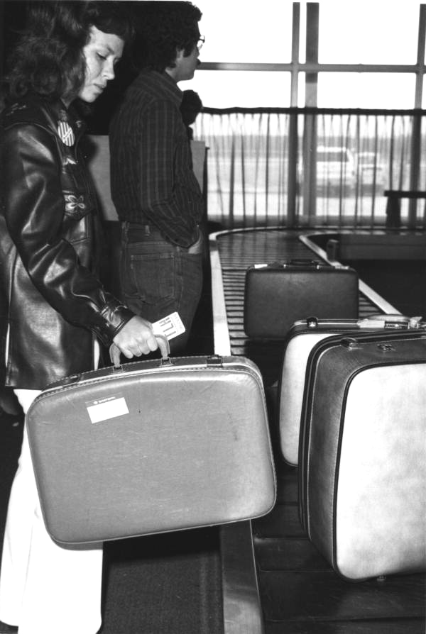 Rebecca Beard picks up her luggage