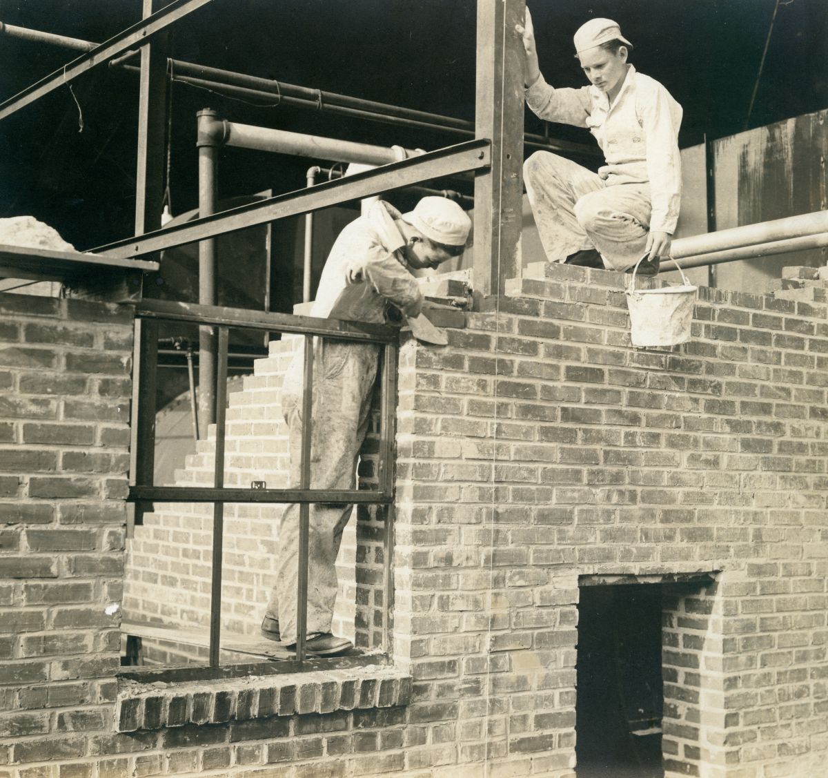 Boys laying brick in the construction of a building at the Florida Industrial School for Boys in Marianna, Florida.