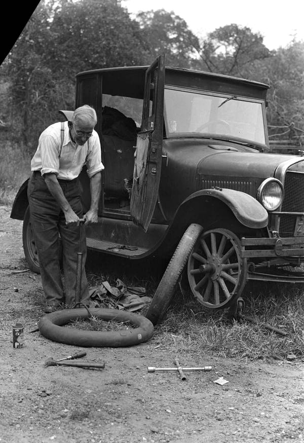 Man changing a tire.