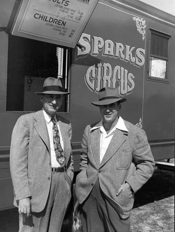 Circus presidents standing next to a Sparks Circus train in Sarasota, Florida.