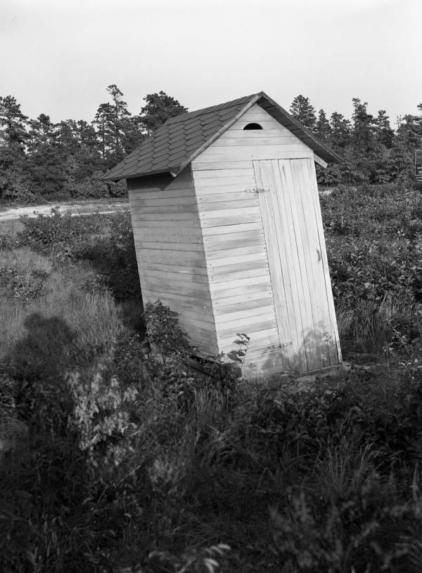 View showing an outhouse.