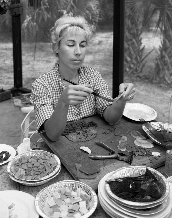Artist Beth Arthur at work on the patio of her home in Sarasota, Florida.