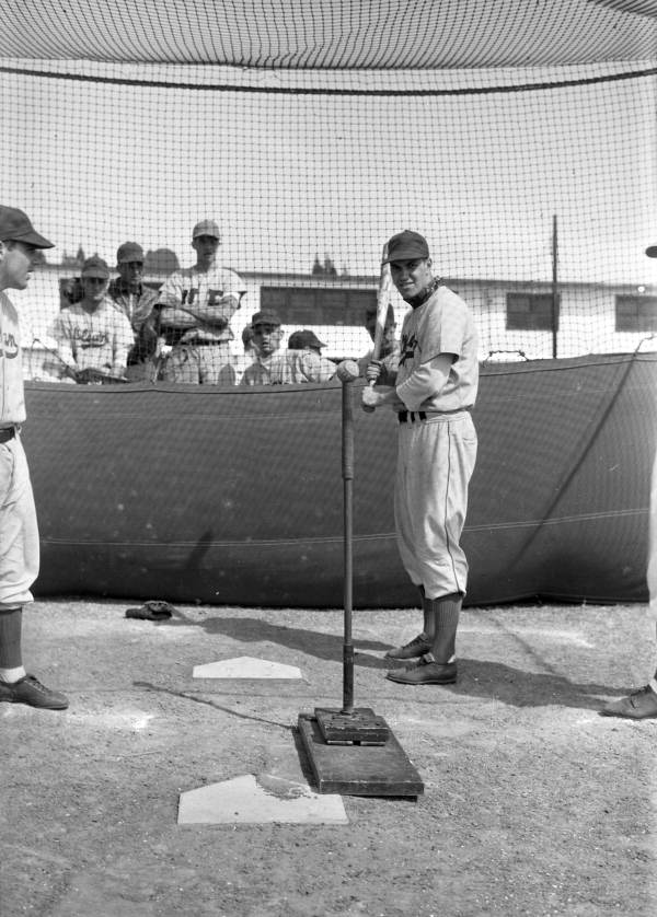 Batter receiving instruction during the Brooklyn Dodgers training camp in Vero Beach, Florida