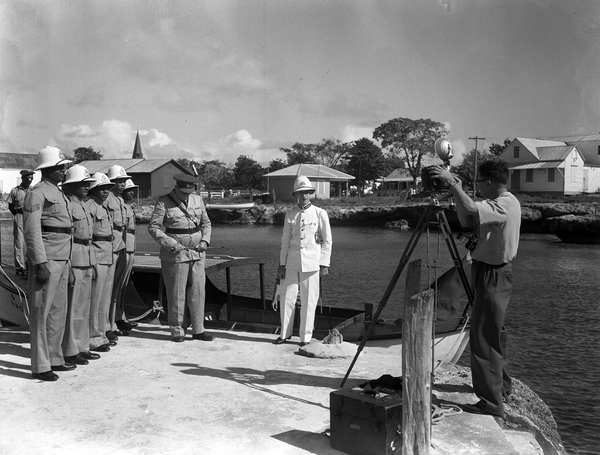Sarasota photographer Joe Steinmetz taking a group portrait of George Town's entire police force (5 men) in the Cayman Islands.