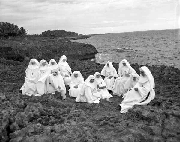 Nuns meditating at dusk on the south rocks in the Dominican Republic.