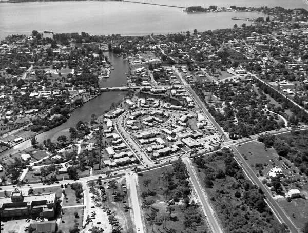 Aerial view looking west over the Florasota Gardens Apartment Hotel complex next to Hudson Bayou in Sarasota, Florida.