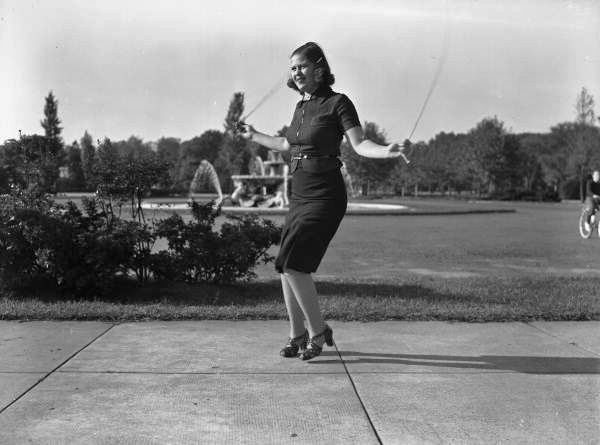 Woman with artificial limb jumping rope in a park at an art museum in Philadelphia, Pennsylvania.