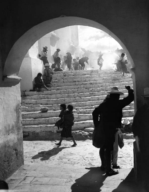 View showing people on the venerated cathedral steps in Chichicastenango, Guatemala.