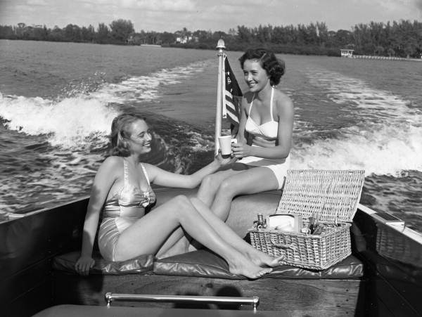Photographer's daughter Lois Duncan Steinmetz, left, and friend Polly Gaines in a motorboat.