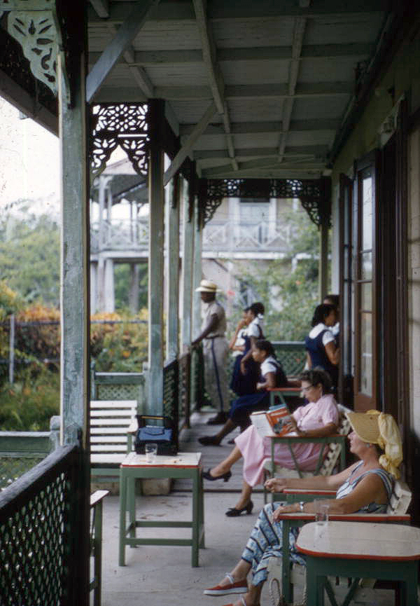 View showing the photographer's wife, Lois Foley Steinmetz, reading on a veranda in Nassau, Bahamas.