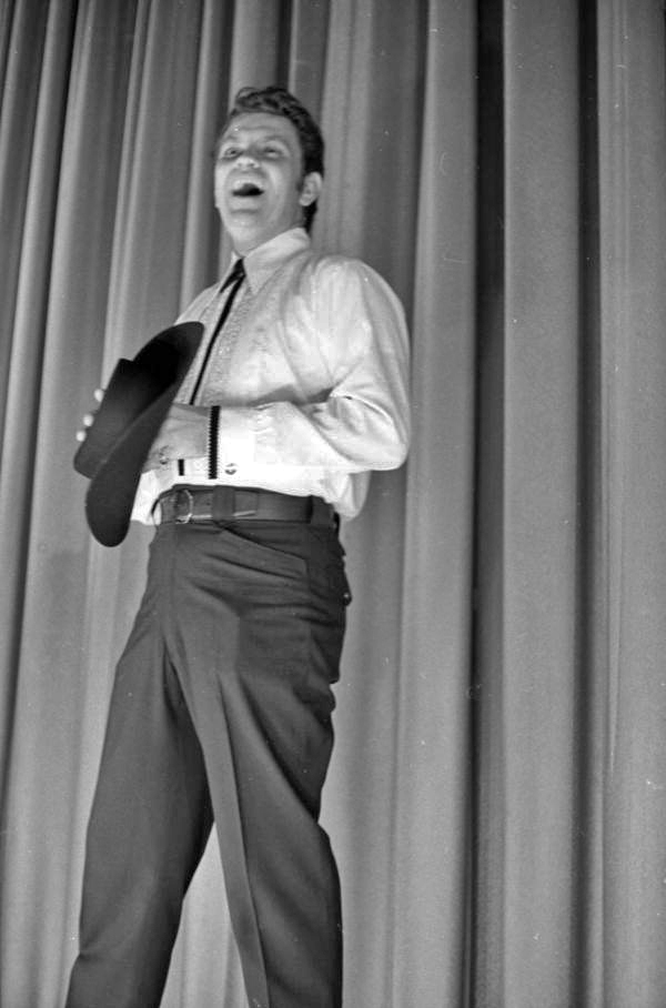 View of a magician on stage during a magic show at the Sarasota Jr. High School.