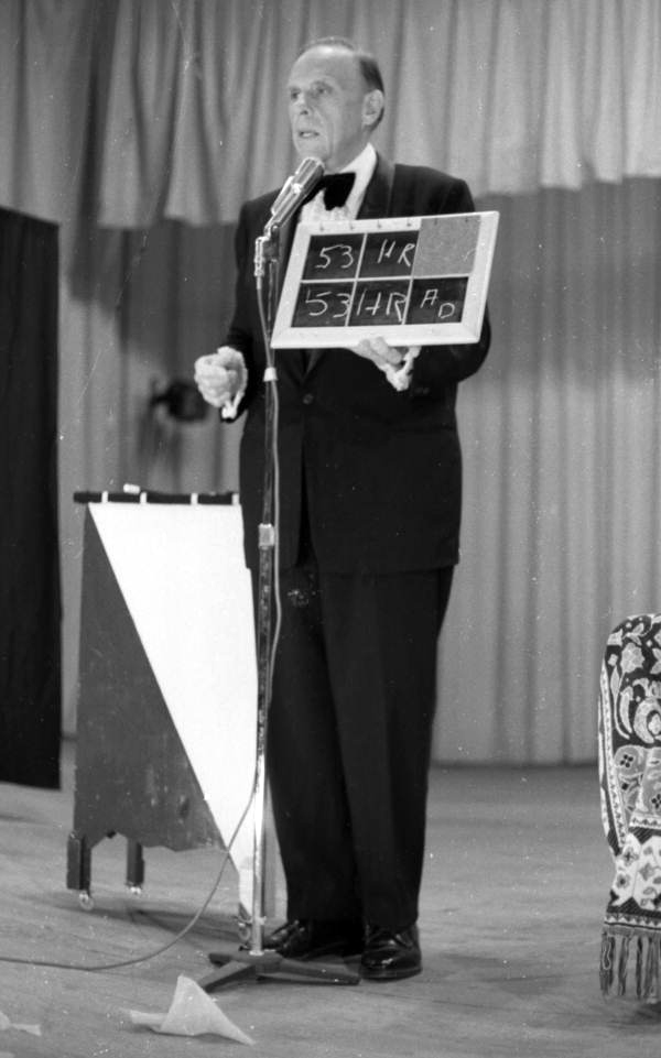 Close-up view of a magician performing on stage during a magic show at the Sarasota Jr. High School.