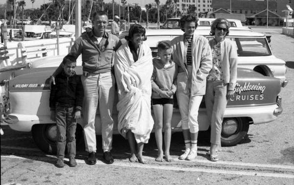 Water skier Nancy Schnering posing with people in Sarasota, Florida.