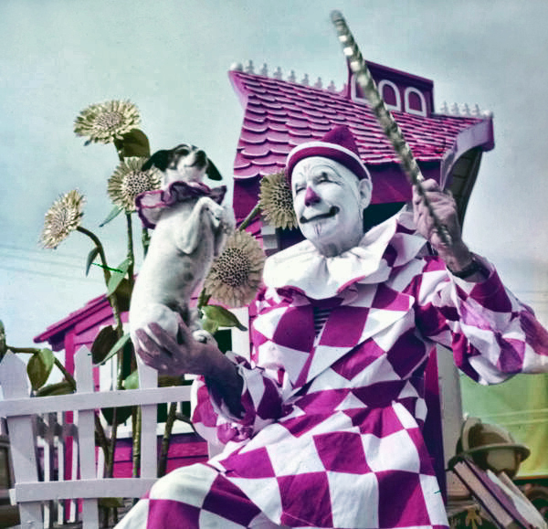 Ringling Circus clown Charlie Bell with his performing pet fox terrier.