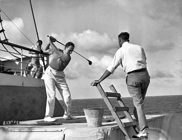 Driving golf balls from ship during cruise.