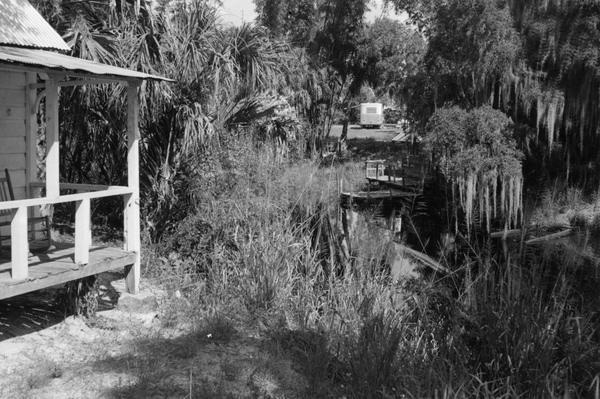 Estero River and corner of the old Koreshan Unity medical cottage.