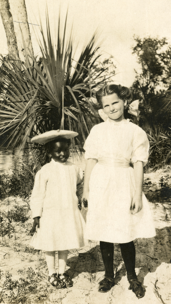 Postcard of two girls at the Koreshan Unity settlement in Estero, Florida.