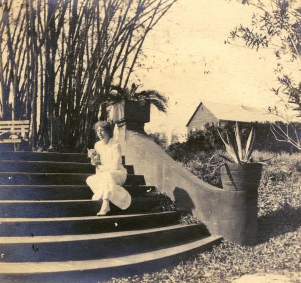 Anna Lewis with "Punch" on steps at the Bamboo Landing on Estero River.