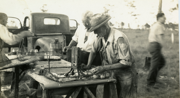 Al Gorton cutting potatoes during a Florida Power and Light Co. fish fry picnic at a school yard in Estero, Florida.